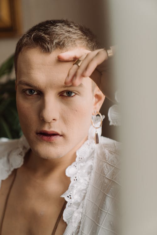 Person in White Floral Lace Top