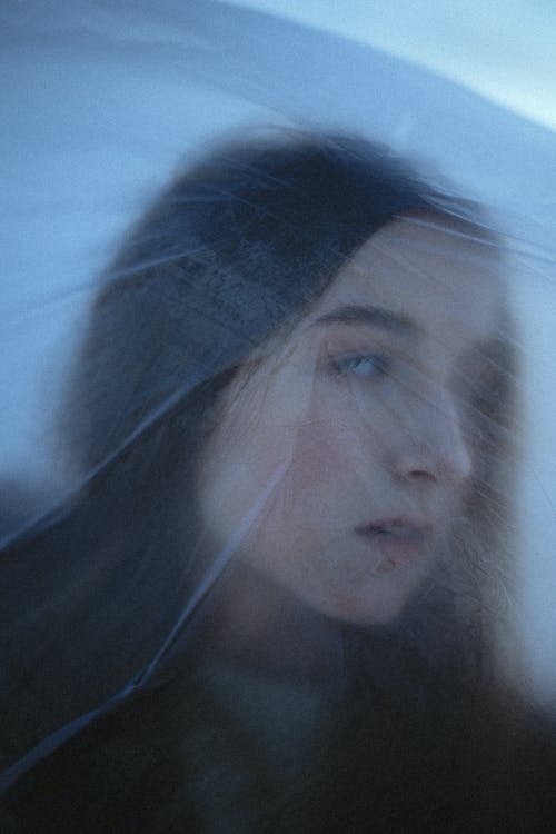 Portrait of Woman Behind Plastic Foil